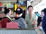 Geishas at train station